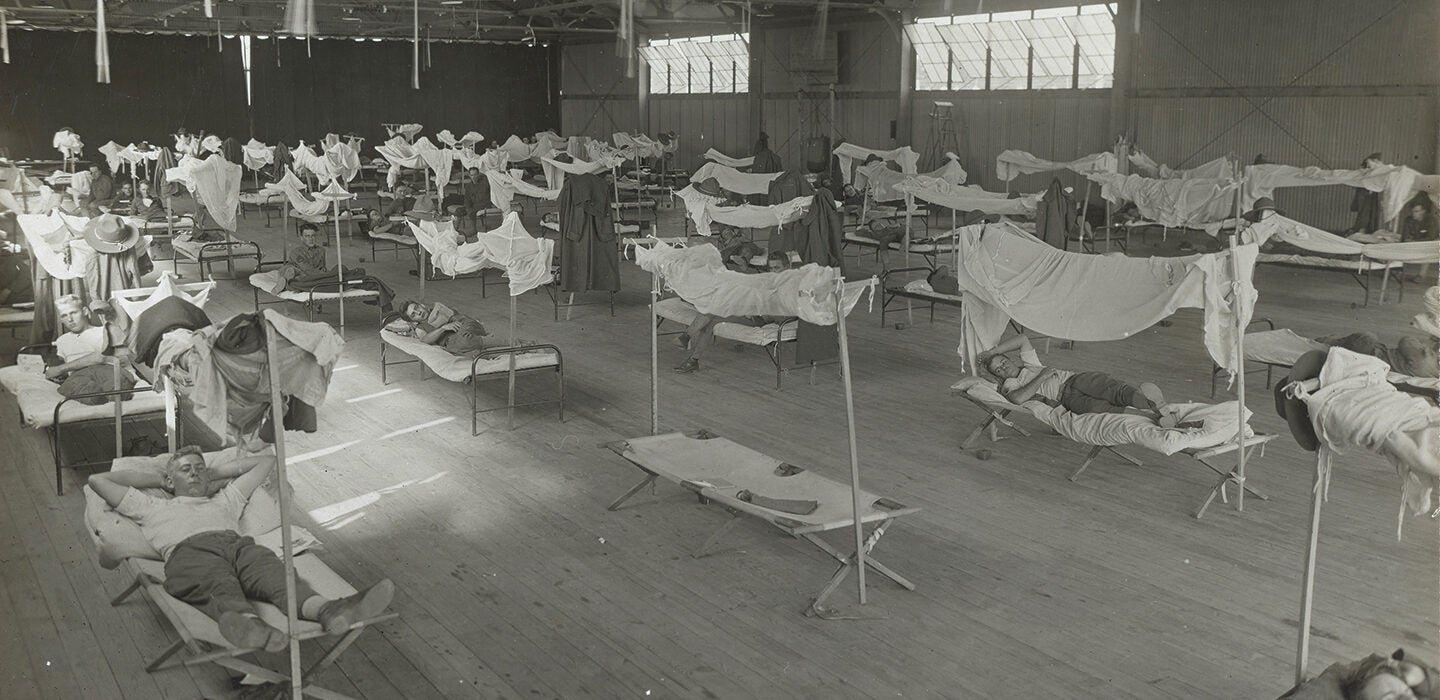 Convalescing influenza patients lying in rudimentary beds at the U.S. Army's Eberts Field facilities in Lonoke, Arkansas, in 1918