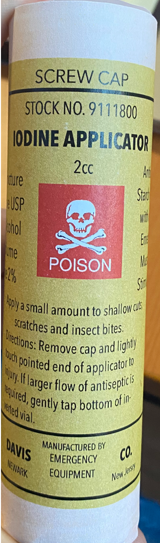 Recreation of a iodine applicator. It is labelled as "poison". The label includes directions of use, the name of the manufacturer and the place where it was produced