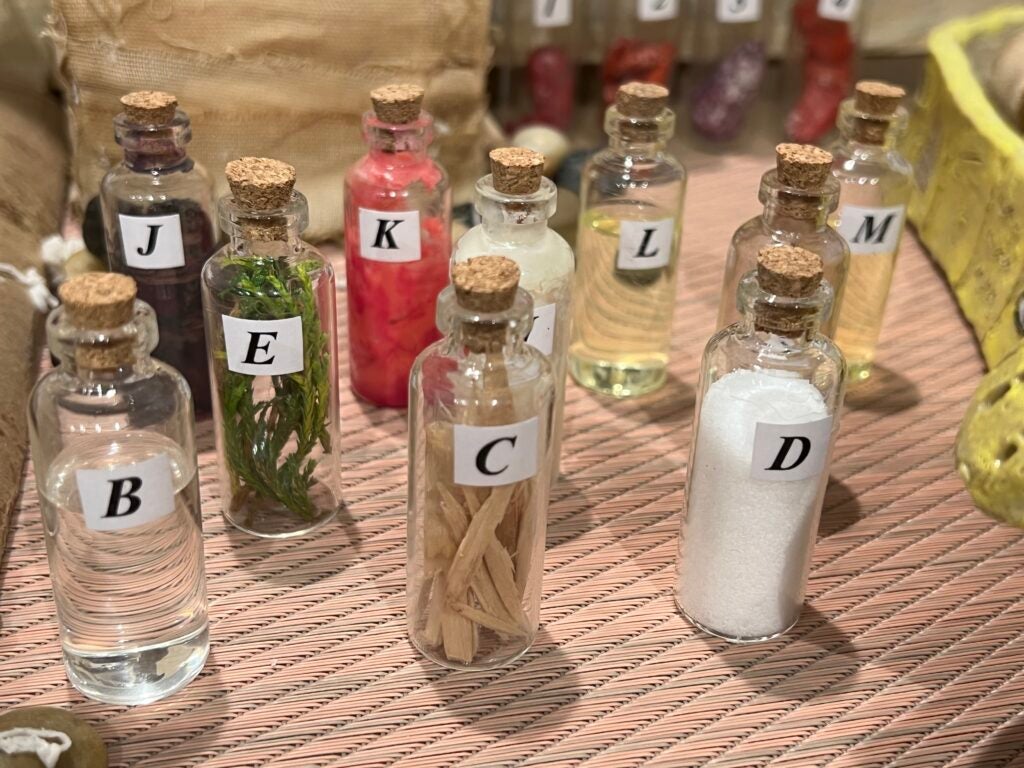 Bottles representing the plant-based materials used in the mummification process