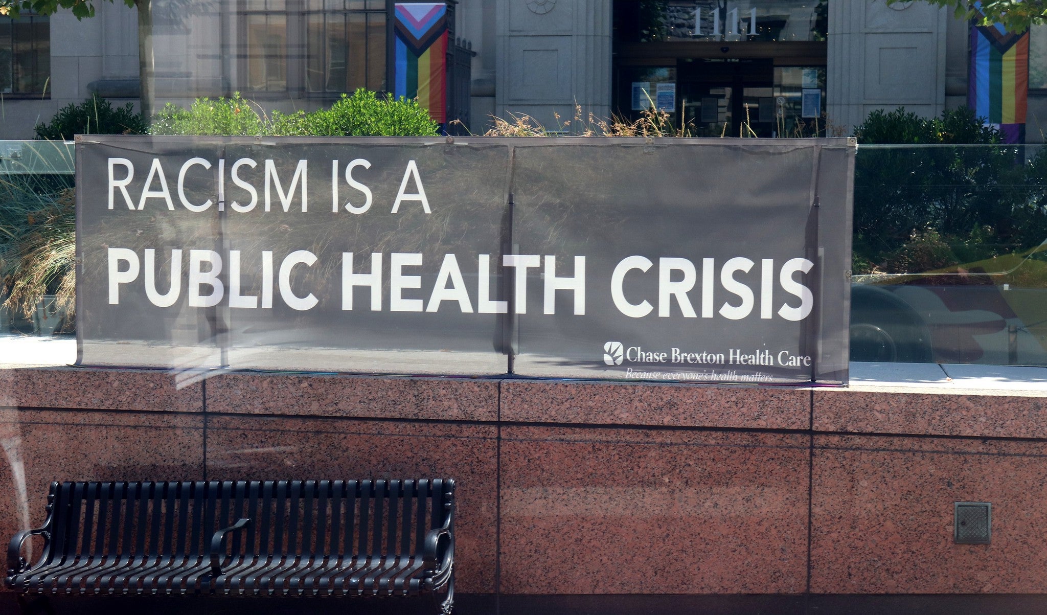 Sign stating "Racism is a public health crisis"