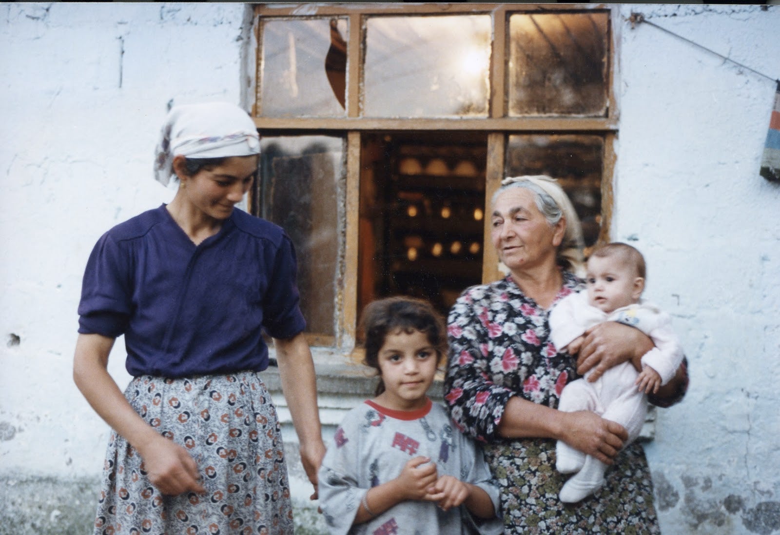 Photograph of a traditional Turkish family: mother, grandmother and two children