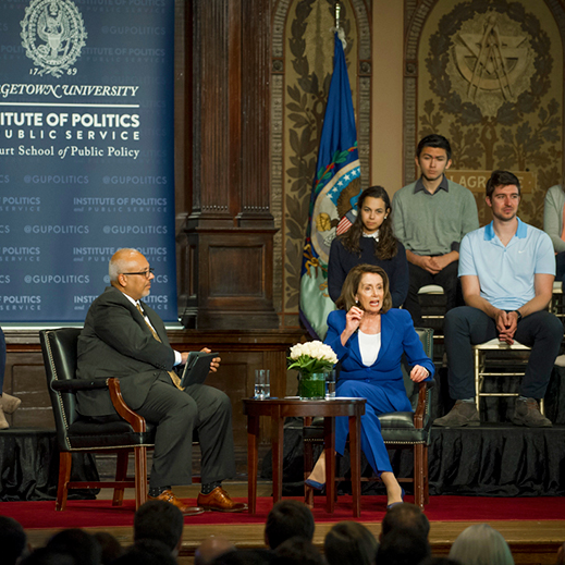 Nancy Pelosi speaking at a panel in Georgetown