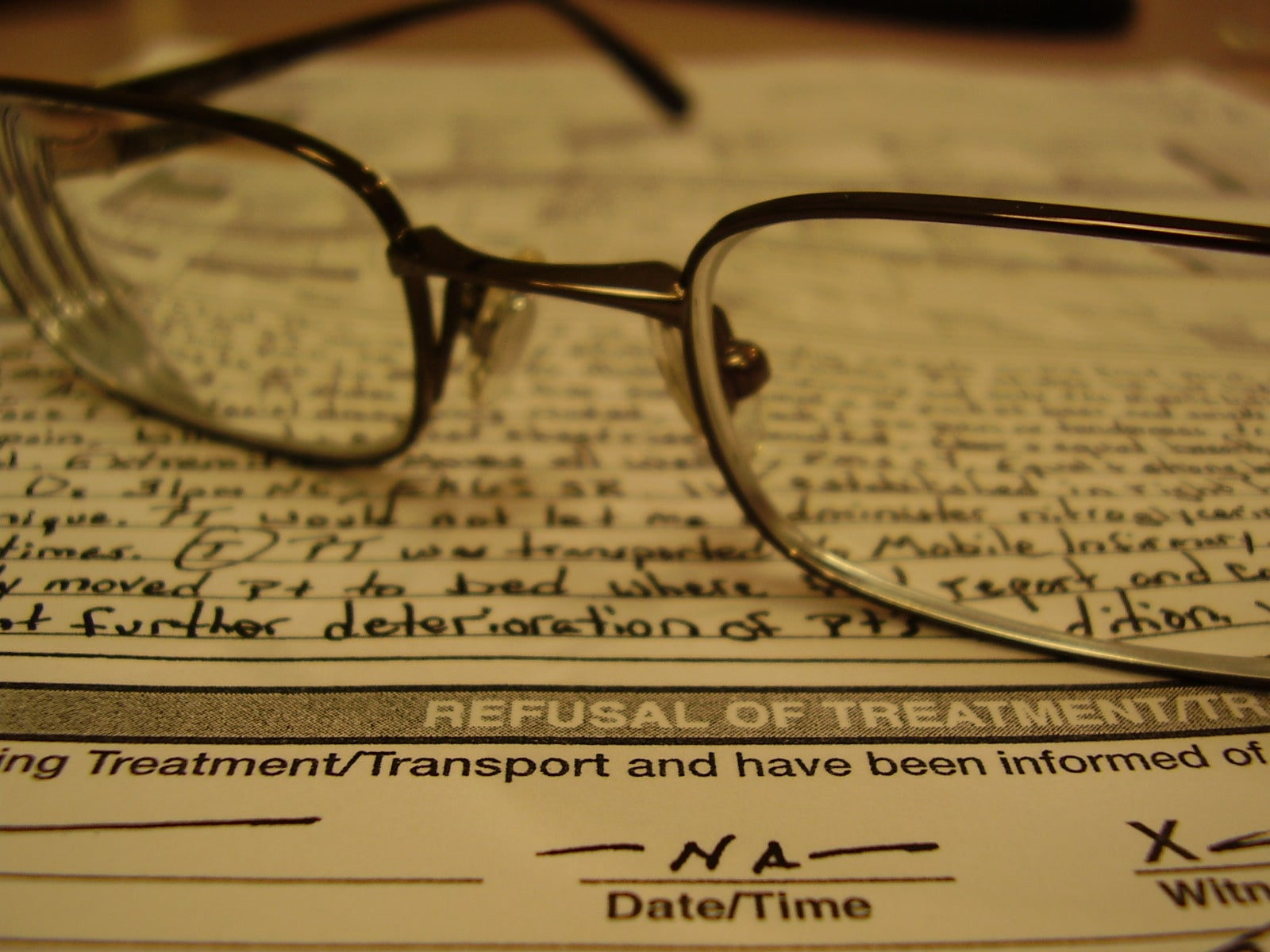 Refusal of treatment form, with glasses on top
