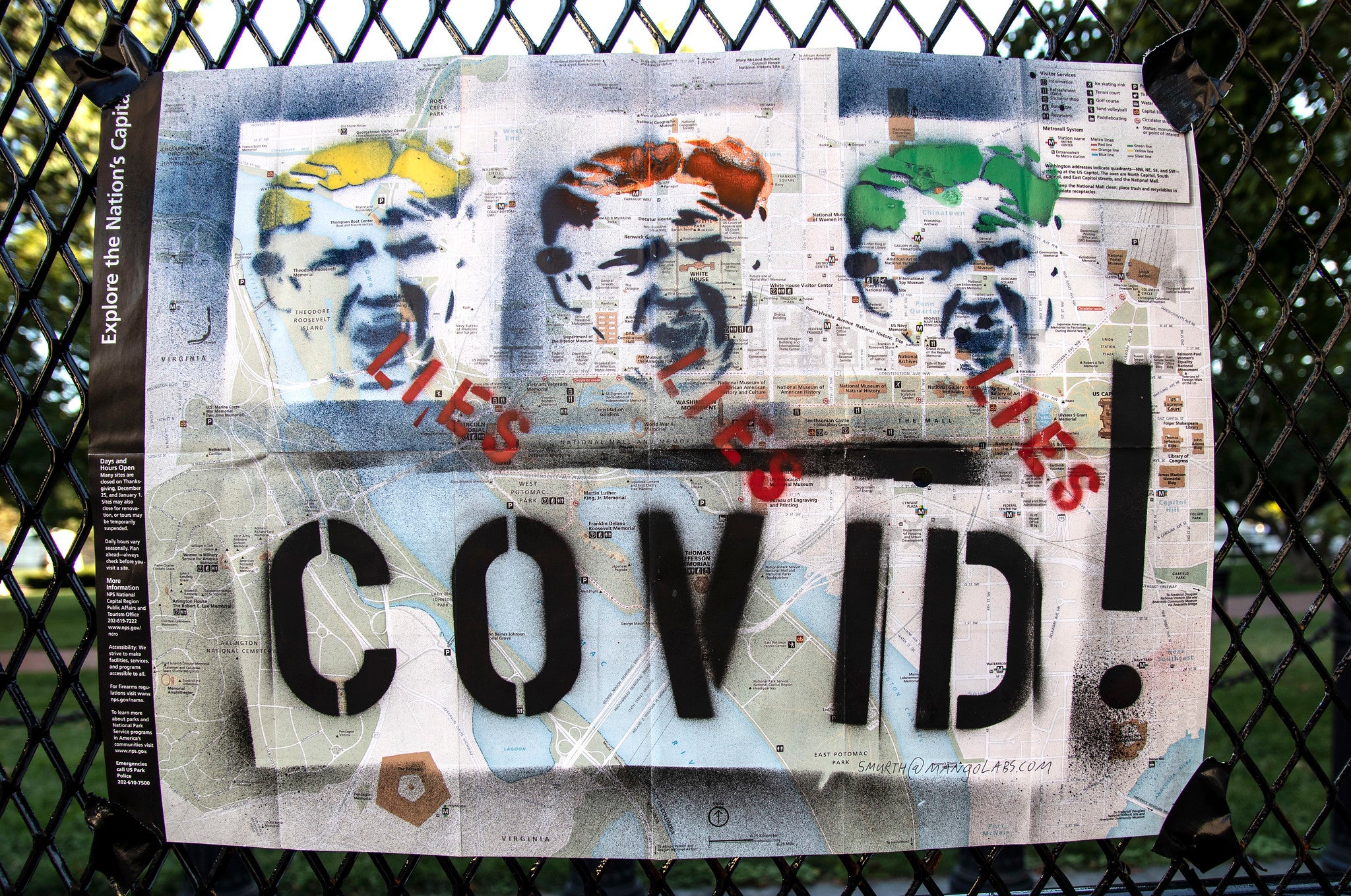 Graffitti covering map of Washington DC. The graffitti shows the icon of Donald Trump three times, the hair color of the first is yellow, of the second red, and the third green. Under each, the word 