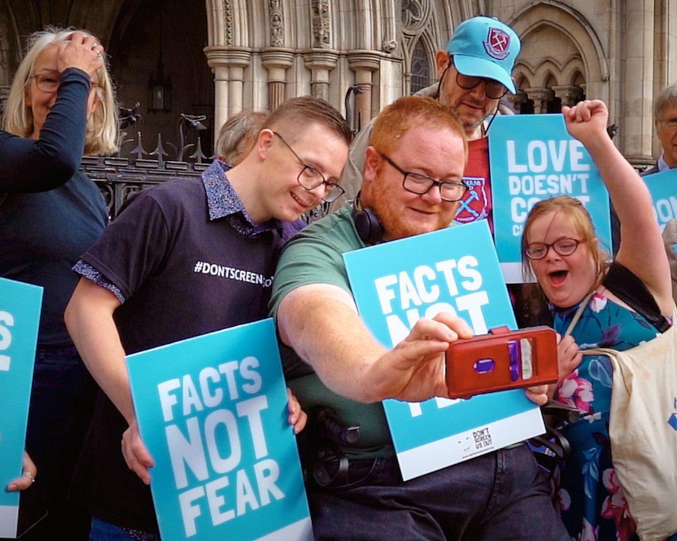 Group of people with disabilities taking a selfie at the Don't Screen Us Out manifestation in London