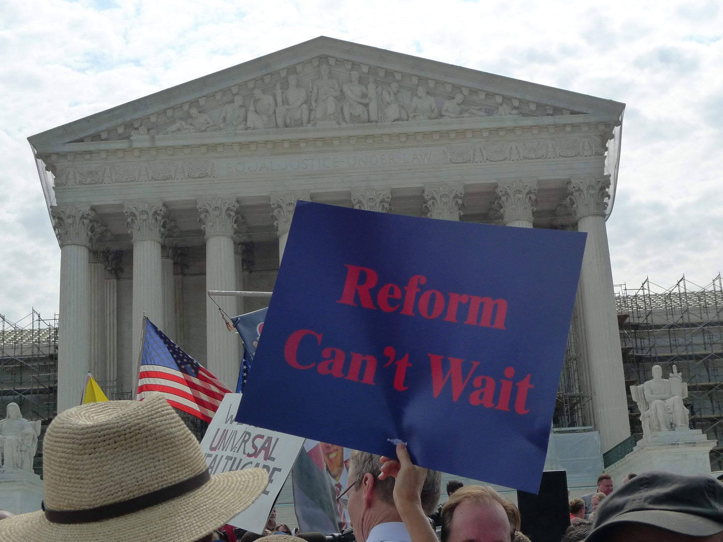 Protest in fron of the Supreme Court. The posters on display say: 