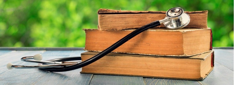 Pile of books with stethoscope