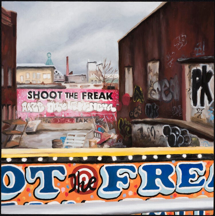 Abandoned patio. The wall on the back has a graffiti with the words: "Shoot the freak"